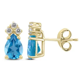 14K Yellow Gold 7X5Mm Pear Blue Topaz And Three Stone Diamond Earrings