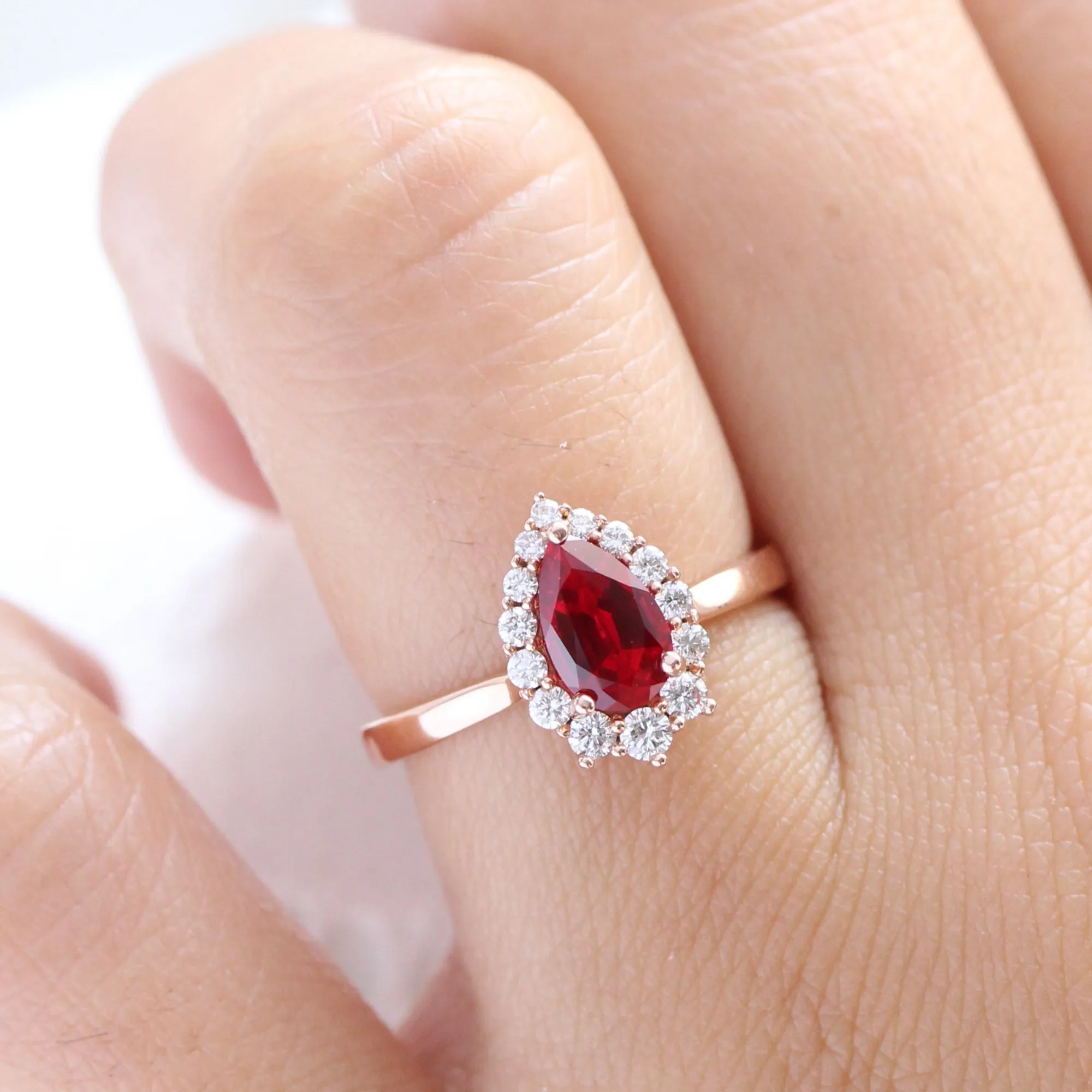 Pear Ruby Engagement Ring in Tiara Halo Diamond Tapered Band