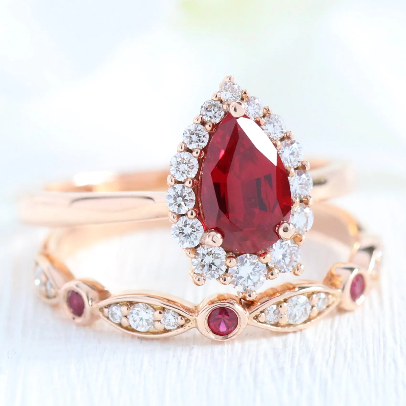 Pear Ruby Engagement Ring in Tiara Halo Diamond Tapered Band